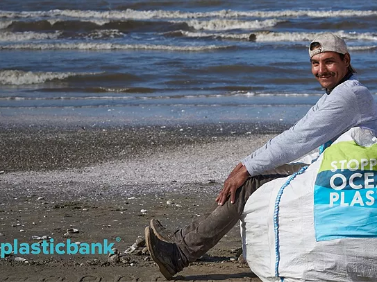 Plastic Bank Promotion by Mohawk featuring a man sitting on a beach